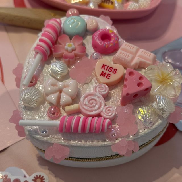A finished heart-shaped decoden jewellery box in pearl cream with lollipops and shells